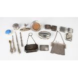 A George V silver evening purse of canted corner rectangular form with fitted leather interior and