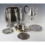 A group of plated items, including a half-reeded baluster coffee pot, a boat-shaped basket, two