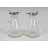 A pair of George V cut glass conical whisky tots with silver collars and tappit lids, Birmingham