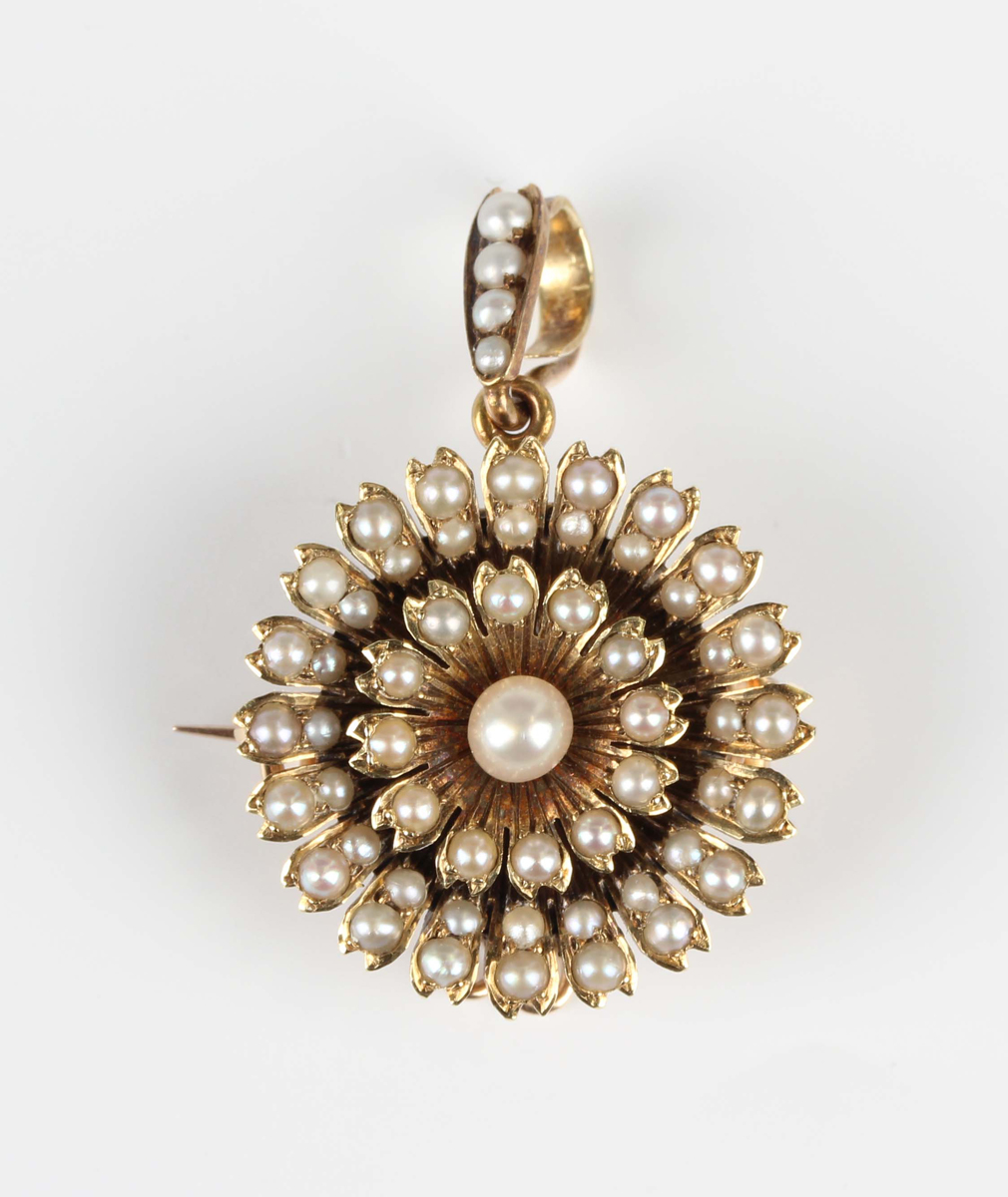 An Edwardian gold and half-pearl pendant brooch, designed as a flowerhead, with a detachable