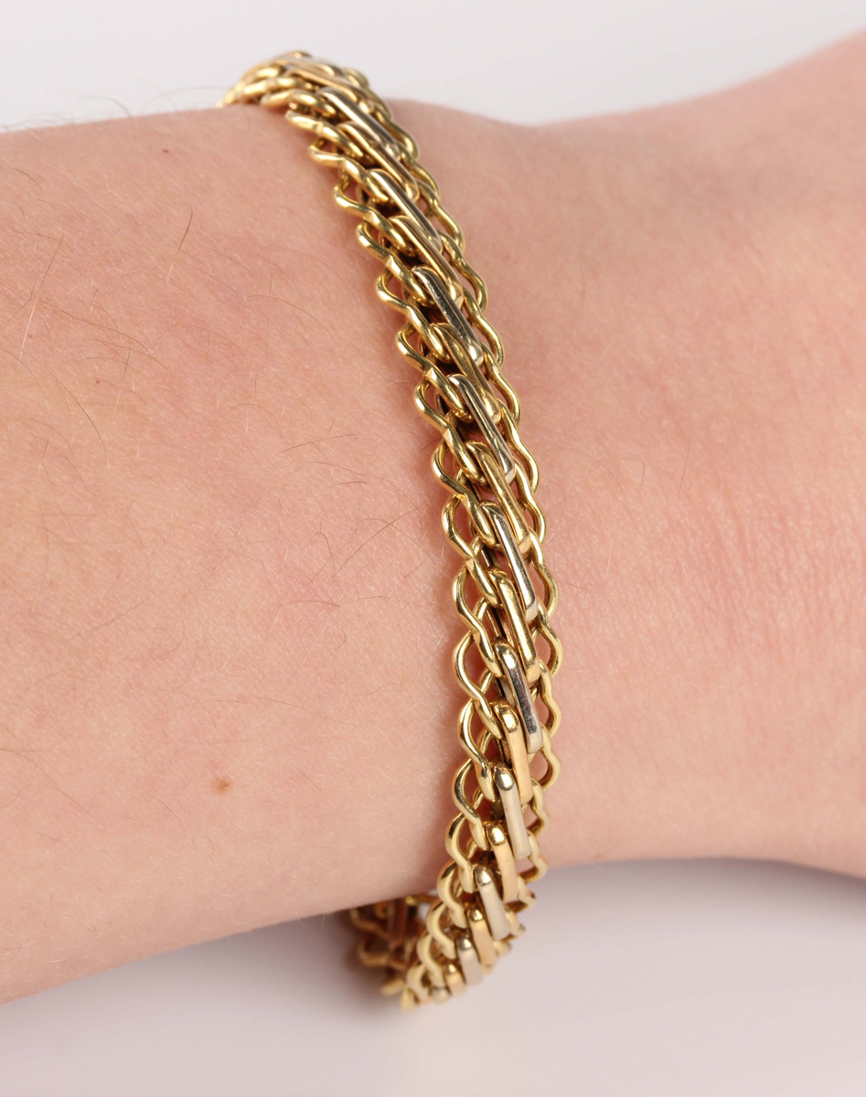 A gold bracelet in a multiple link design, detailed '750', on a boltring clasp, weight 7.4g, - Image 2 of 2