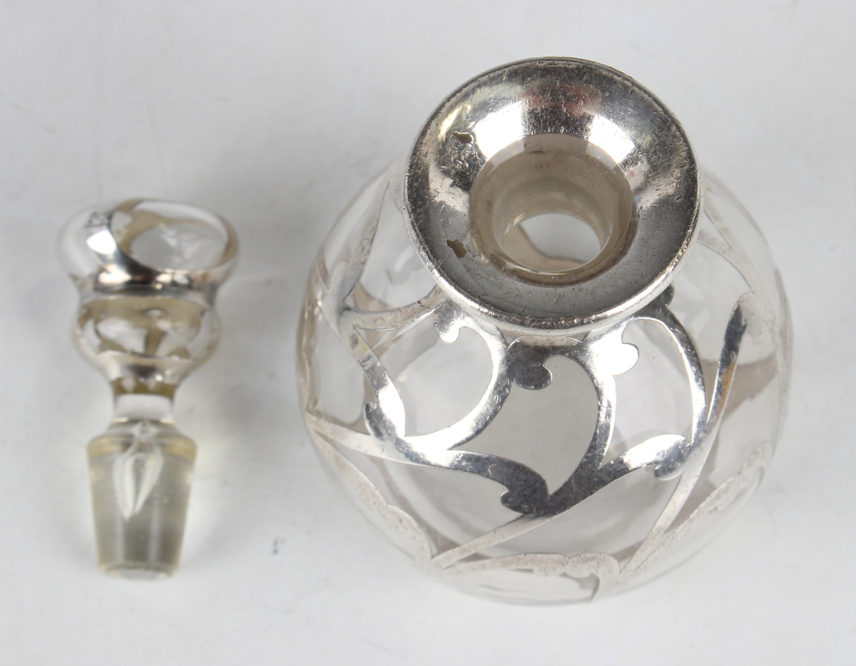 An early 20th century silver overlaid clear glass scent bottle and stopper of globular form with - Image 2 of 2