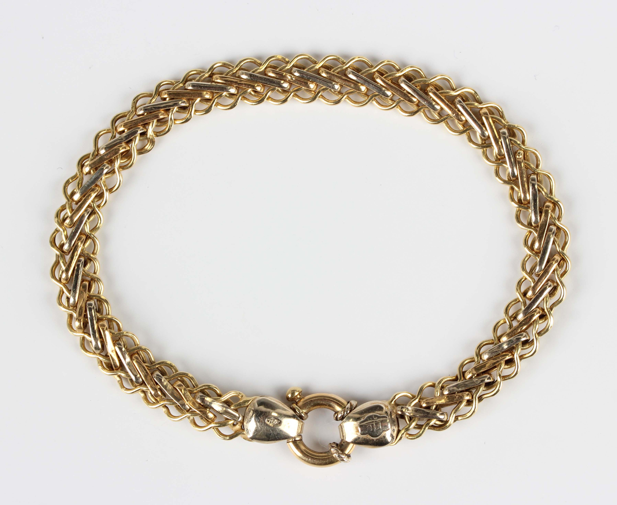 A gold bracelet in a multiple link design, detailed '750', on a boltring clasp, weight 7.4g,