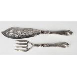 A pair of early Victorian silver fish servers, the blades pierced and engraved with foliate