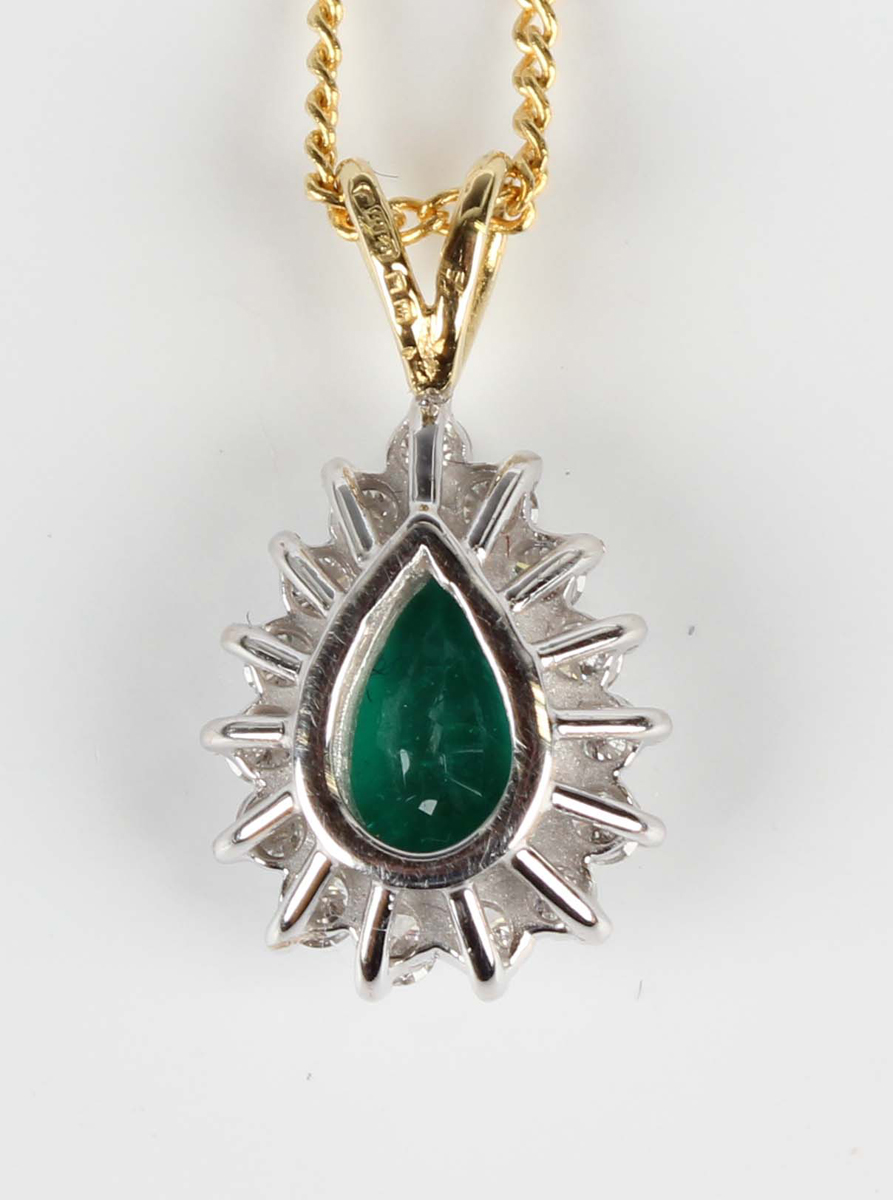 An 18ct two colour gold, emerald and diamond cluster pendant, claw set with a pear shaped emerald - Image 3 of 4