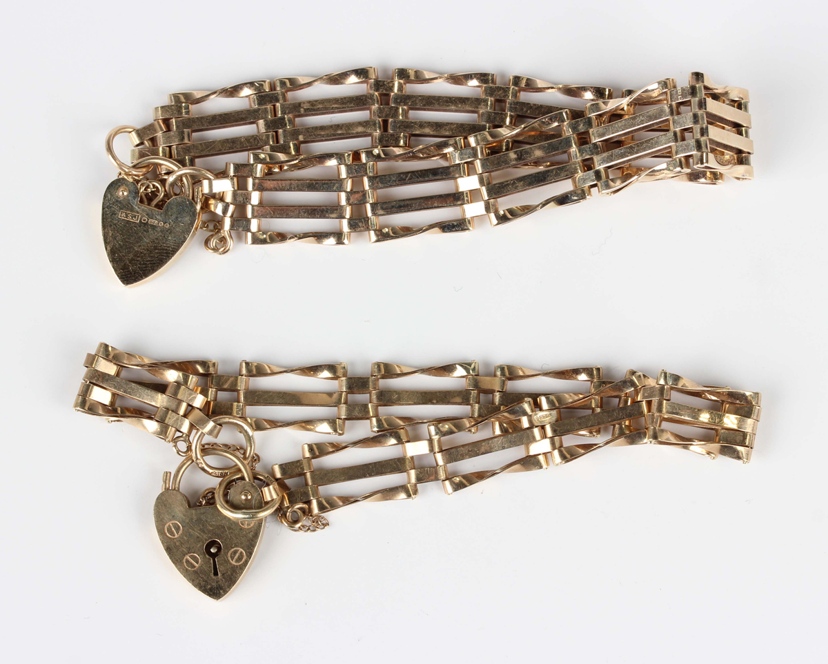 A 9ct gold bar and twisted bar link gate bracelet with a 9ct gold heart shaped padlock clasp, length