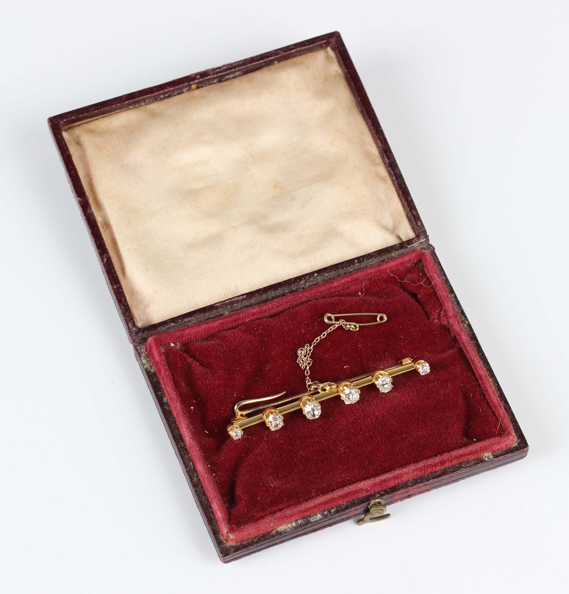 An Edwardian gold and diamond six stone bar brooch, claw set with a row of cushion cut diamonds - Image 3 of 4