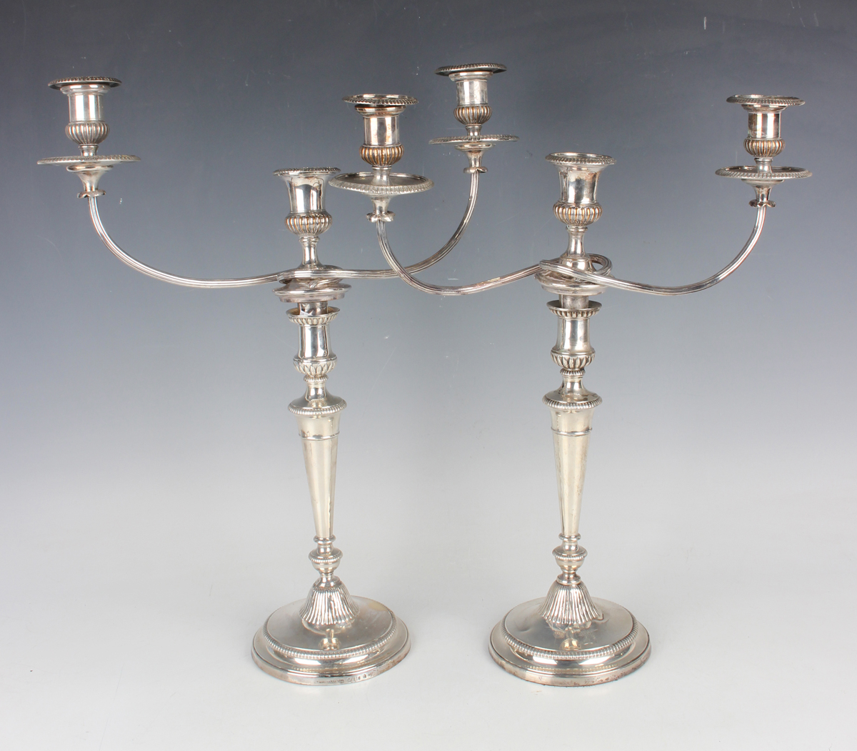 A pair of George III silver candlesticks, each sconce with reeded and foliate decoration above a - Image 3 of 4