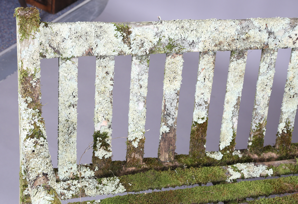 A 20th century teak garden bench, covered in green lichen, height 81cm, width 182cm, depth 70cm. - Image 11 of 11