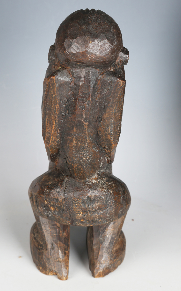 An African carved dense hardwood figure of stylized form, height 26cm, together with an African - Image 4 of 4