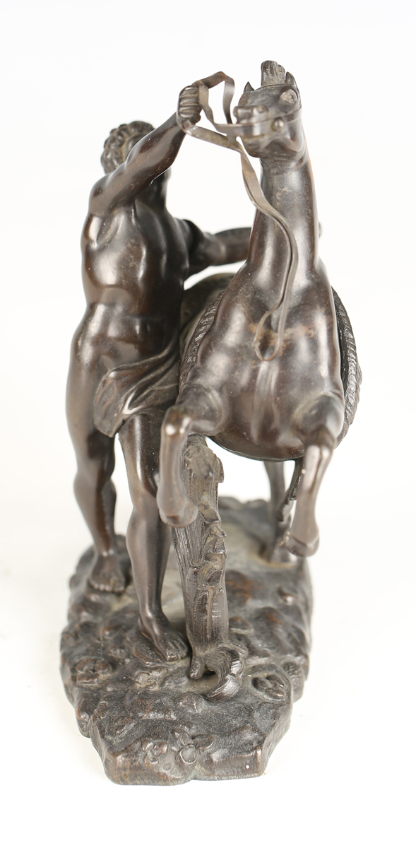 After Guillaume Coustou - a 19th century brown patinated cast bronze model of a Marly horse and - Image 6 of 12