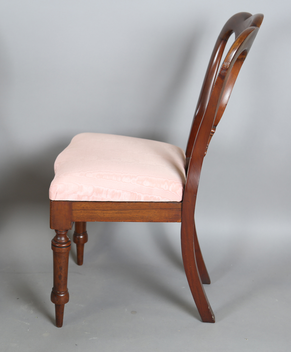 A set of four Victorian mahogany dining chairs, the shaped backs above upholstered drop-in seats, on - Image 6 of 9