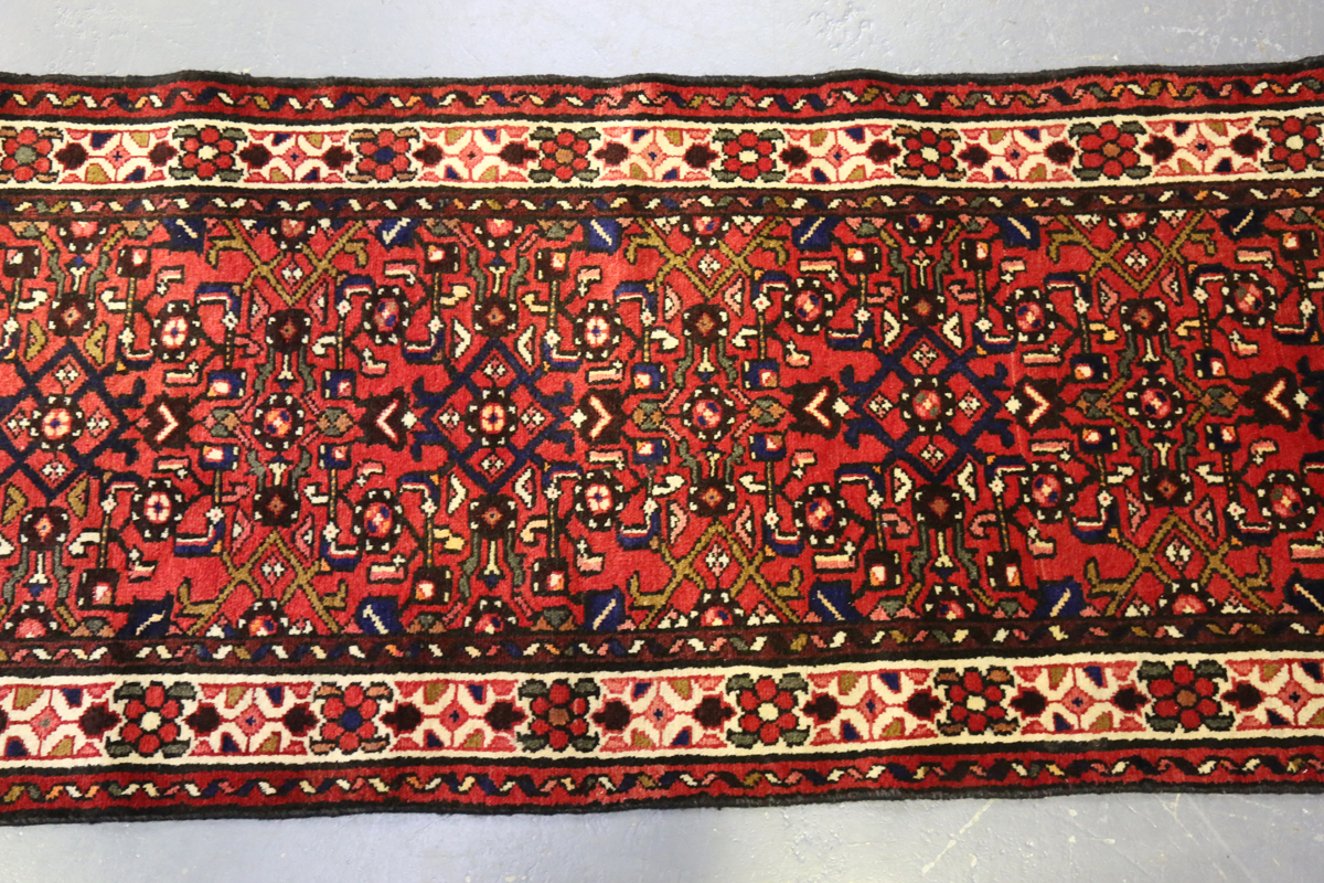 A Malayer runner, North-west Persia, mid/late 20th century, the red field with an overall floral - Image 7 of 8