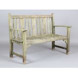 A 20th century teak garden bench with slatted seat and back, height 88cm, width 122cm, depth 60cm.