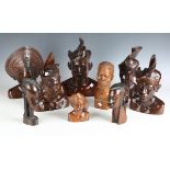 A group of 20th century Balinese carved wooden busts, mainly modelled wearing traditional