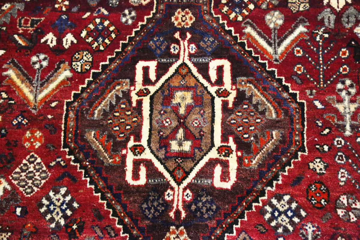 A Ghashghai rug, South-west Persia, late 20th century, the red field with three linked medallions, - Image 7 of 8