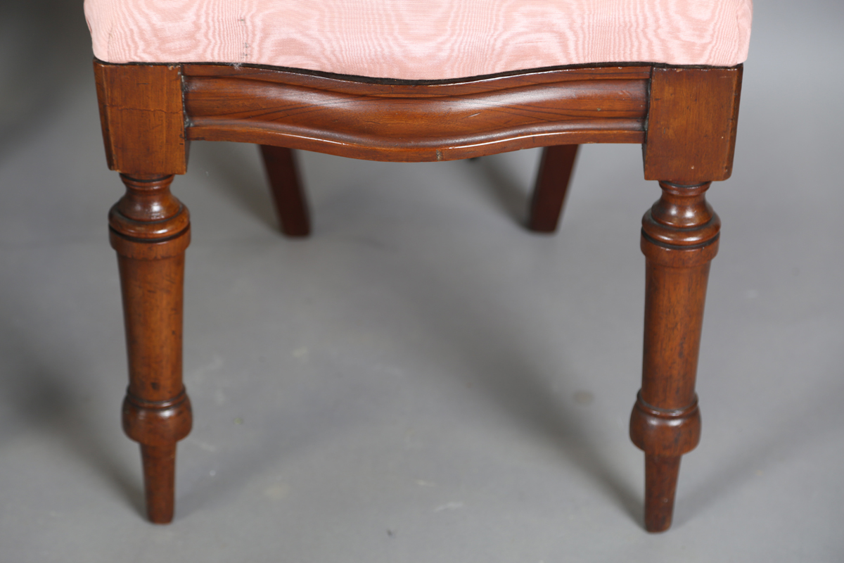 A set of four Victorian mahogany dining chairs, the shaped backs above upholstered drop-in seats, on - Image 7 of 9