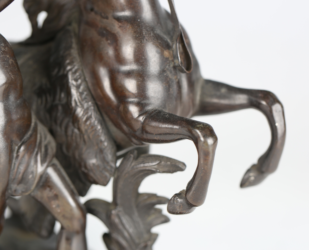 After Guillaume Coustou - a 19th century brown patinated cast bronze model of a Marly horse and - Image 10 of 12