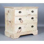 A 19th century stripped pine chest of three drawers, fitted with pressed brass handle plates, height