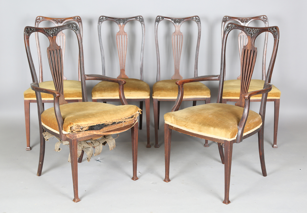 A set of six Edwardian Art Nouveau mahogany chairs by James Shoolbred & Co, comprising two carvers