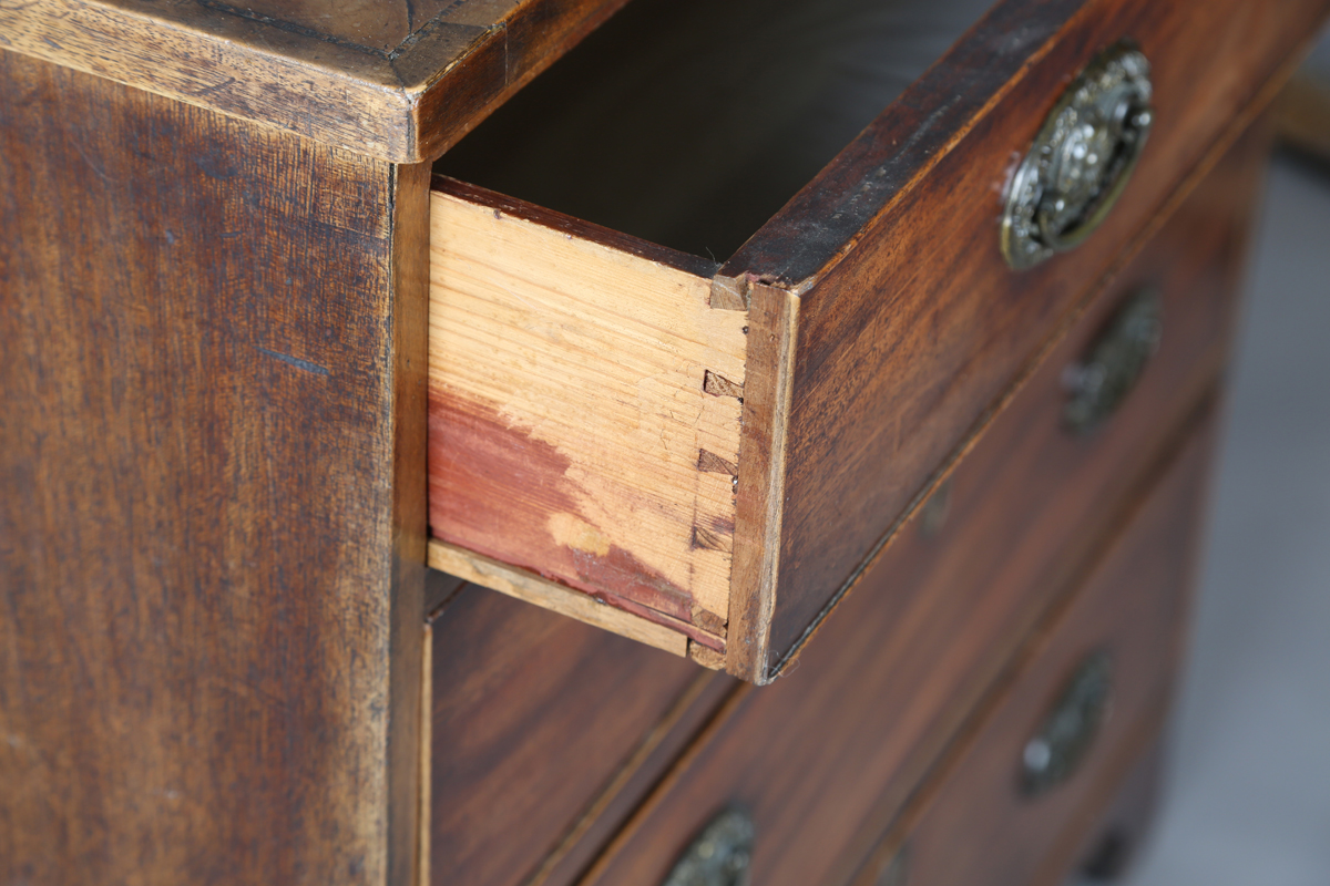 A George III mahogany chest of four graduated long drawers, fitted with oval embossed brass - Image 6 of 8