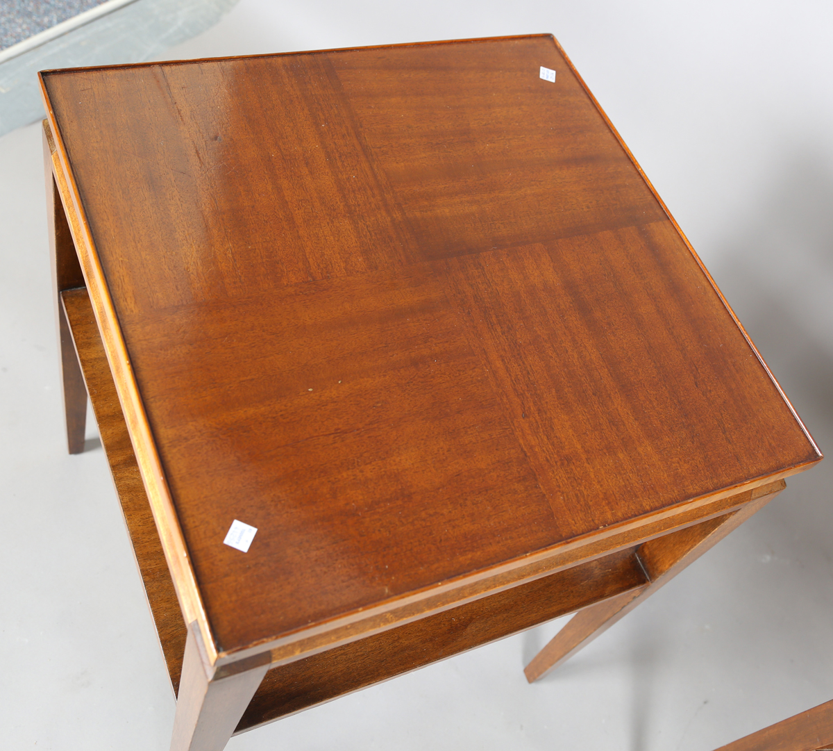 A pair of mid-20th century French mahogany lamp tables of retro design, the quarter-veneered tops - Image 4 of 8