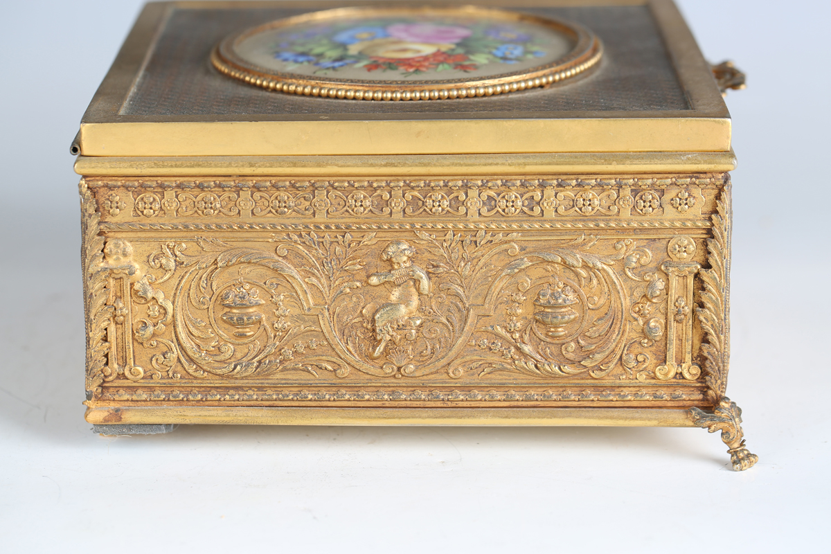 An early 20th century French gilt metal jewellery casket, the top inset with a floral painted - Image 4 of 9