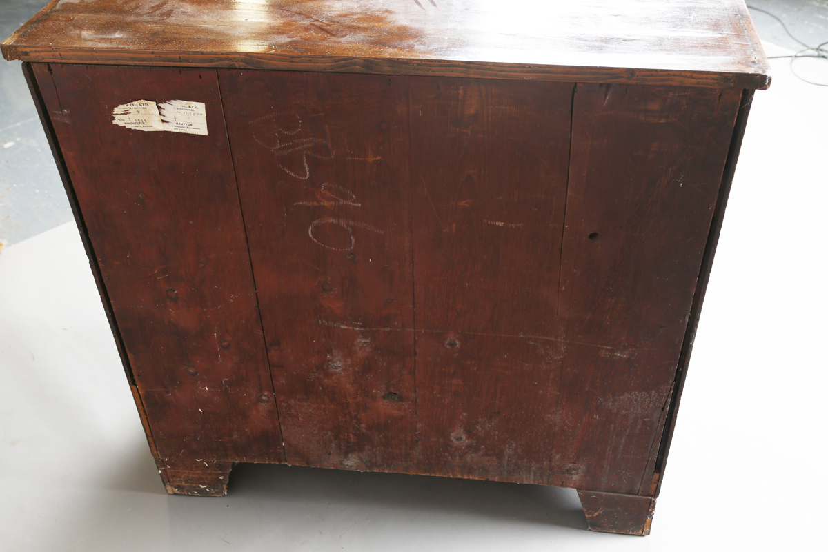 A George III mahogany chest of four graduated long drawers, fitted with oval embossed brass - Image 3 of 8