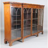 An early 20th century mahogany breakfront bookcase, fitted with four lancet glazed doors, height