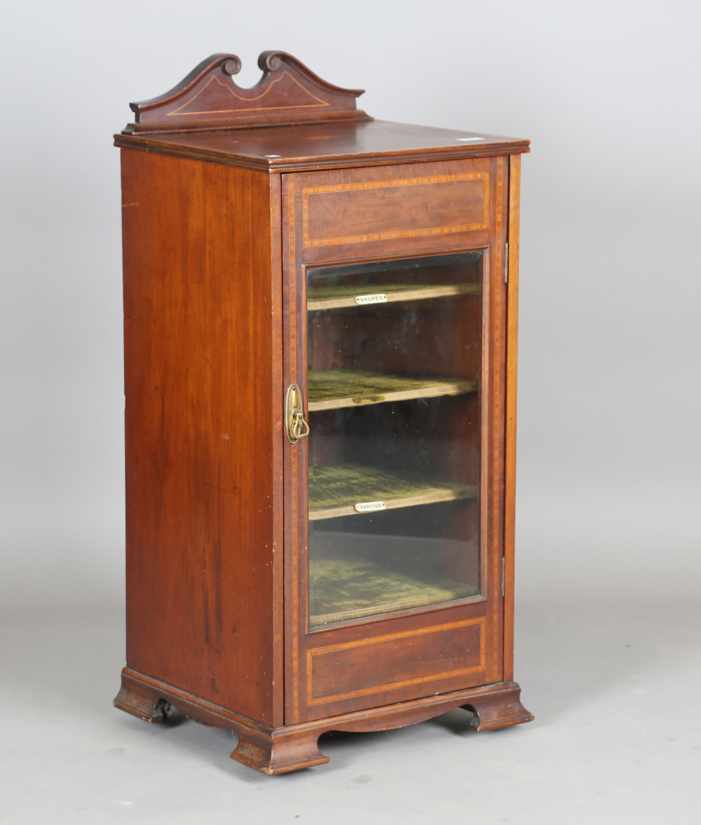 An Edwardian mahogany music cabinet with satinwood crossbanding, height 102cm, width 47cm, depth