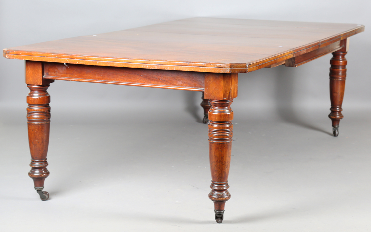 An Edwardian walnut extending dining table with two extra leaves, height 72cm, extended length - Image 8 of 8