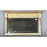 A Regency giltwood and gesso overmantel mirror, the ballshot pediment above a foliate strapwork