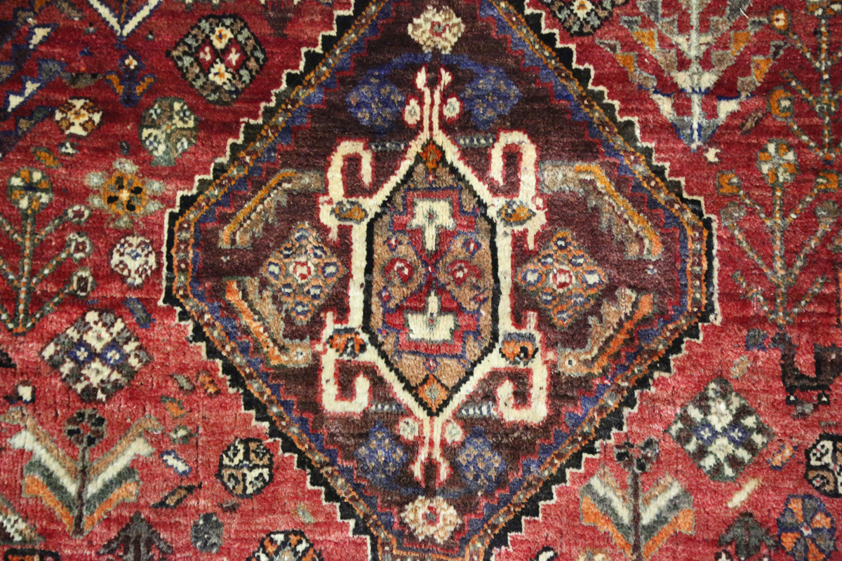 A Ghashghai rug, South-west Persia, late 20th century, the red field with three linked medallions, - Image 6 of 8