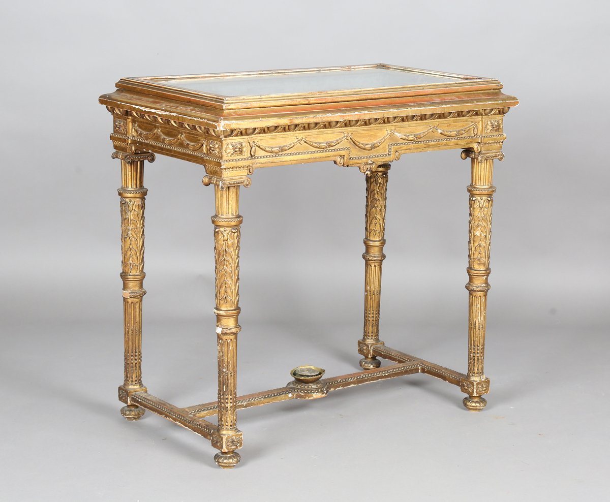 A 19th century Neoclassical Revival giltwood and gesso bijouterie table, the hinged top above a