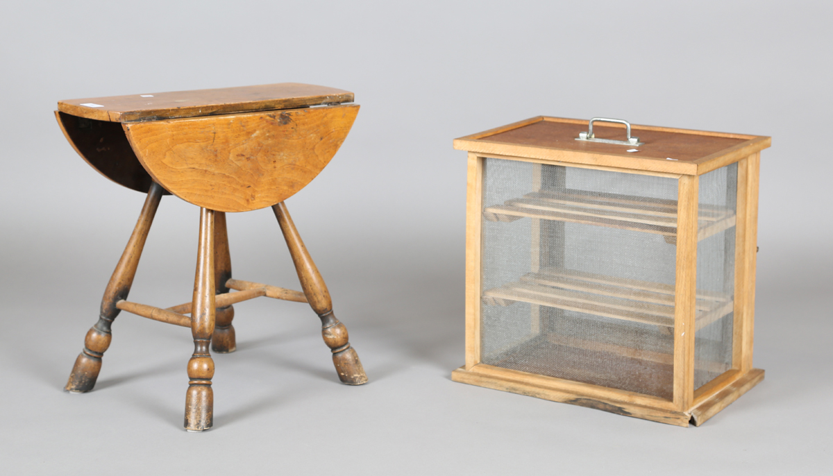 A late 19th/early 20th century French fruitwood folding occasional table, height 50cm, diameter