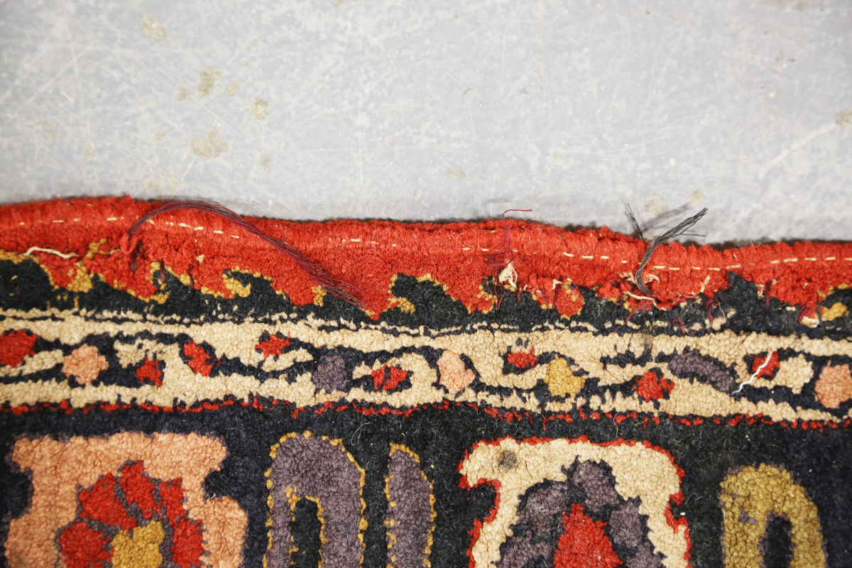 A Persian style rug, 20th century, the deep terracotta field with a column of palmettes, within a - Image 5 of 12