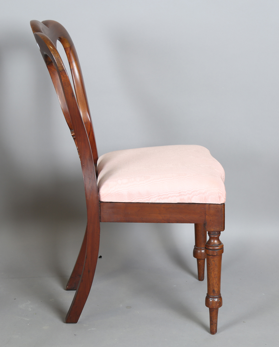 A set of four Victorian mahogany dining chairs, the shaped backs above upholstered drop-in seats, on - Image 4 of 9