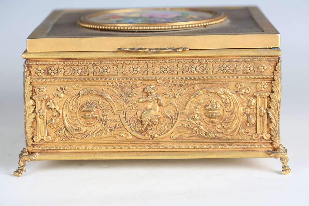 An early 20th century French gilt metal jewellery casket, the top inset with a floral painted - Image 7 of 9