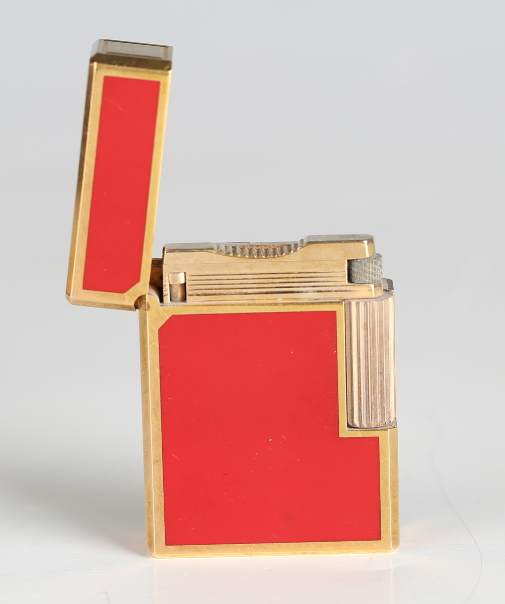 An S.T. Dupont Paris gilt metal and red enamel pocket lighter, detailed 'B5AG53', length 4.6cm, - Image 7 of 8