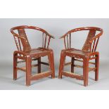 A pair of Chinese painted softwood armchairs with horseshoe backs and panelled seats, height 88cm,
