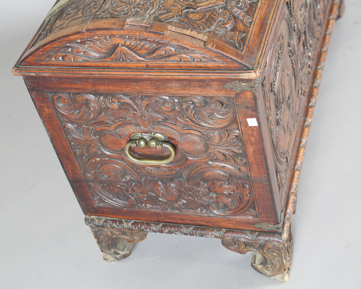 An 18th century French walnut domed trunk, finely carved with coats of arms, initials and further - Image 4 of 14