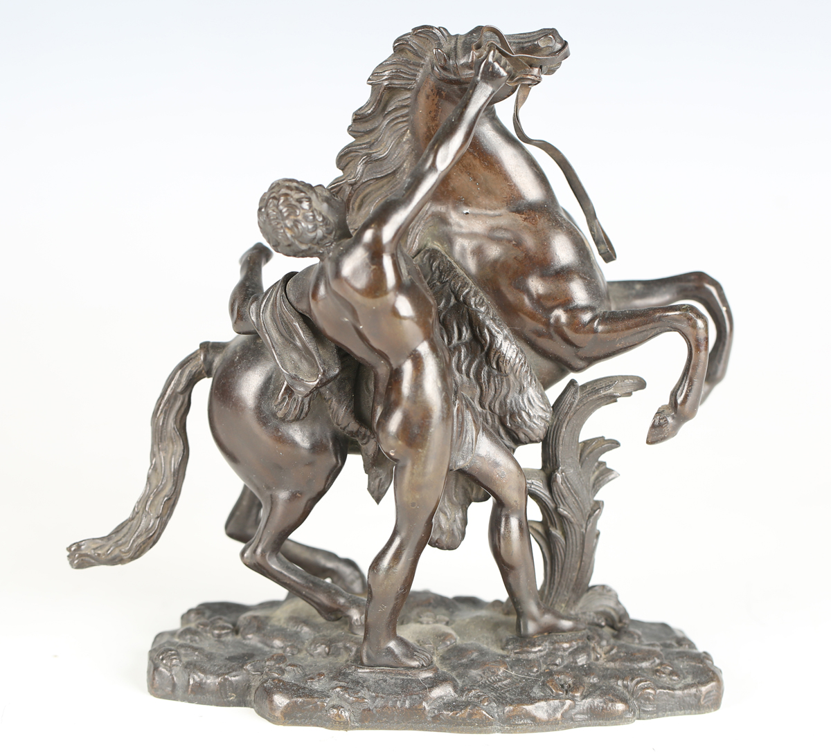 After Guillaume Coustou - a 19th century brown patinated cast bronze model of a Marly horse and - Image 7 of 12