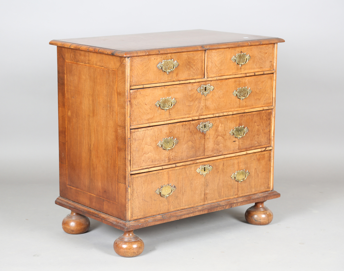 A Queen Anne 18th century style walnut chest with cross and feather banded decoration, fitted with