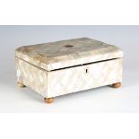 A late 19th century mother-of-pearl veneered rectangular workbox with silk-lined interior and