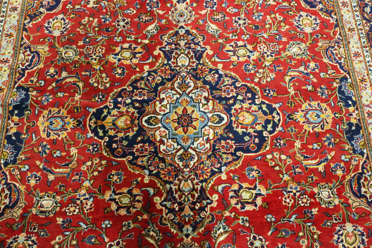 A Kashan carpet, Central Persia, modern, the red field with a shaped medallion, within a blue - Image 9 of 9