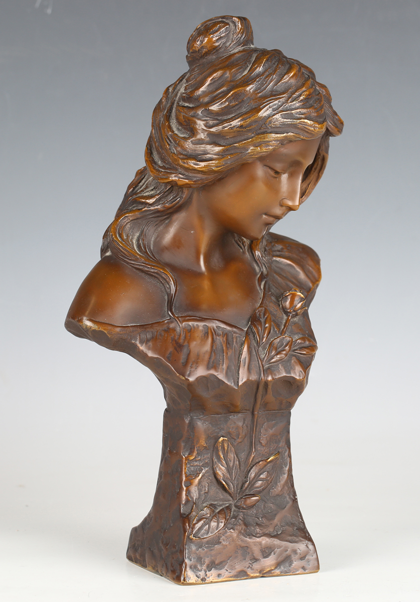 After Emanuel Villanis - a 20th century brown patinated cast bronze bust of a young maiden,