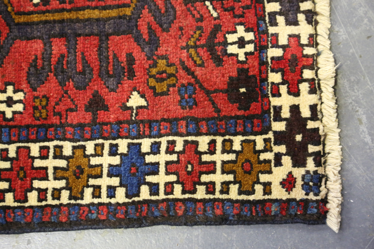 A Heriz runner, North-west Persia, mid-20th century, the red field with a column of hooked - Image 3 of 7