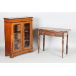 A 19th century mahogany 'D' shaped fold-over tea table, fitted with a drawer, on ring turned legs,