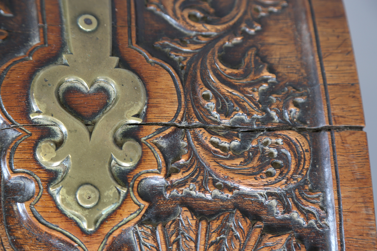 An 18th century French walnut domed trunk, finely carved with coats of arms, initials and further - Image 8 of 14