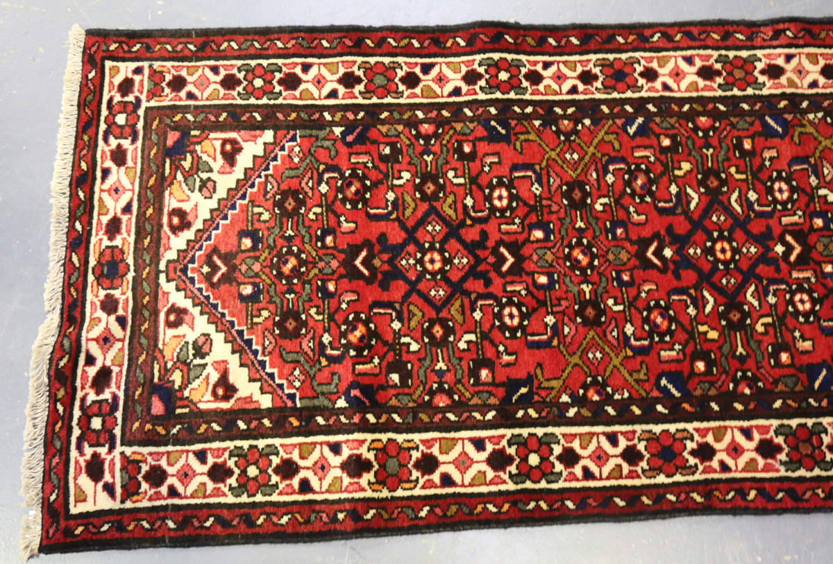 A Malayer runner, North-west Persia, mid/late 20th century, the red field with an overall floral - Image 8 of 8